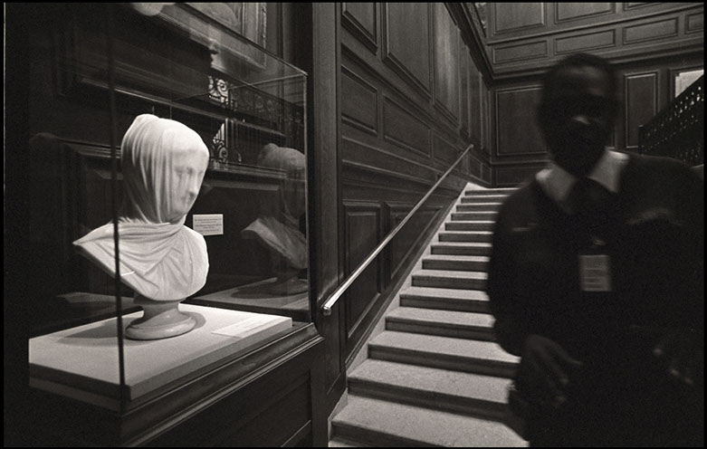 Musuem guard beside statue of "Veiled Nun" at the Corcoran Gallery, Washington, D.C. Linda Johnson Photography, Linda Johnson Photographs.