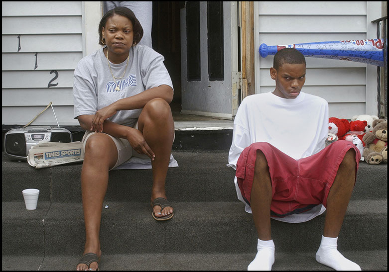 Woman and man on doorstep of their house, Philadelphia, Pennsylvania. Linda Johnson Photography, Linda Johnson Photographs.
